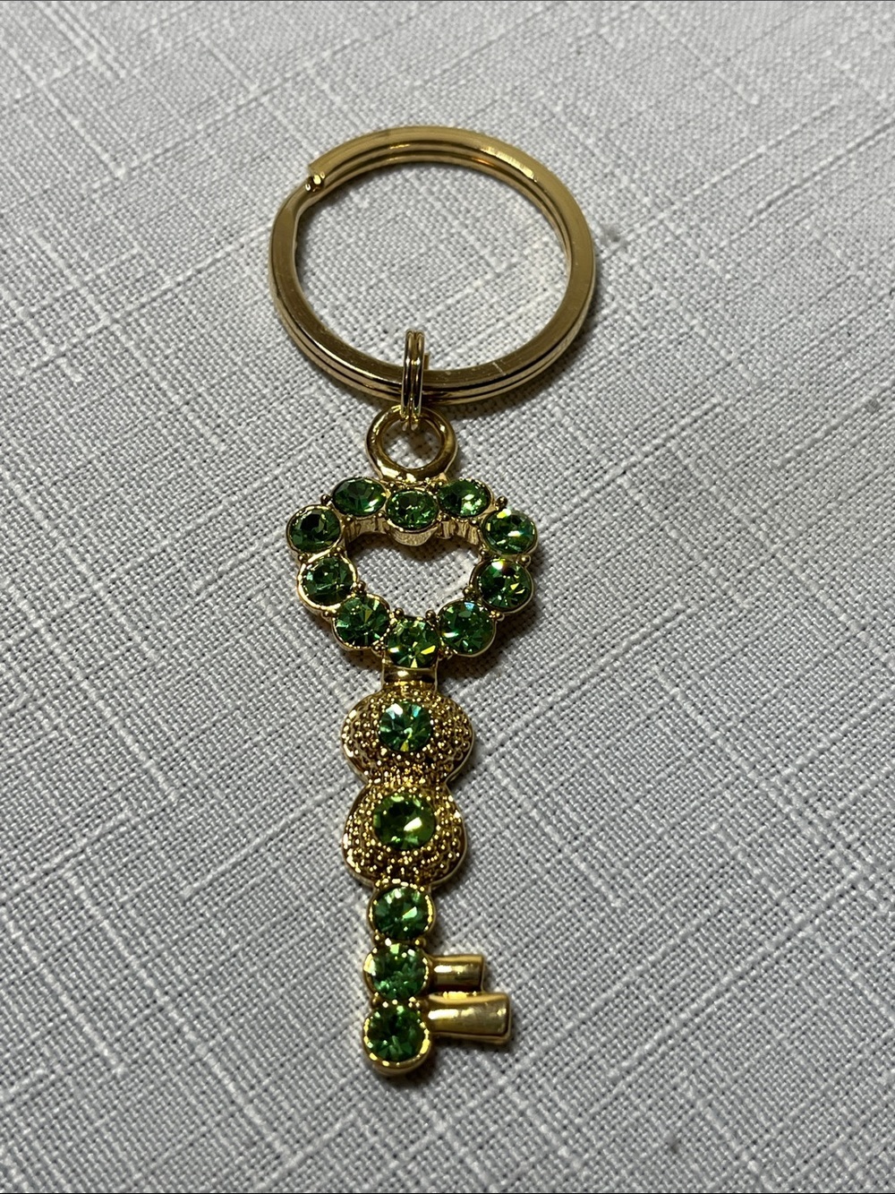 Avon Gold Key Charm Keychain with Green Rhinestones
New
Great gift